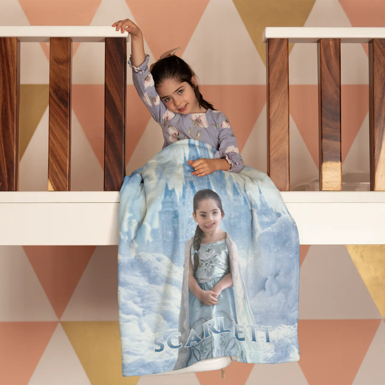 Girl sitting with her custom blanket with face and name