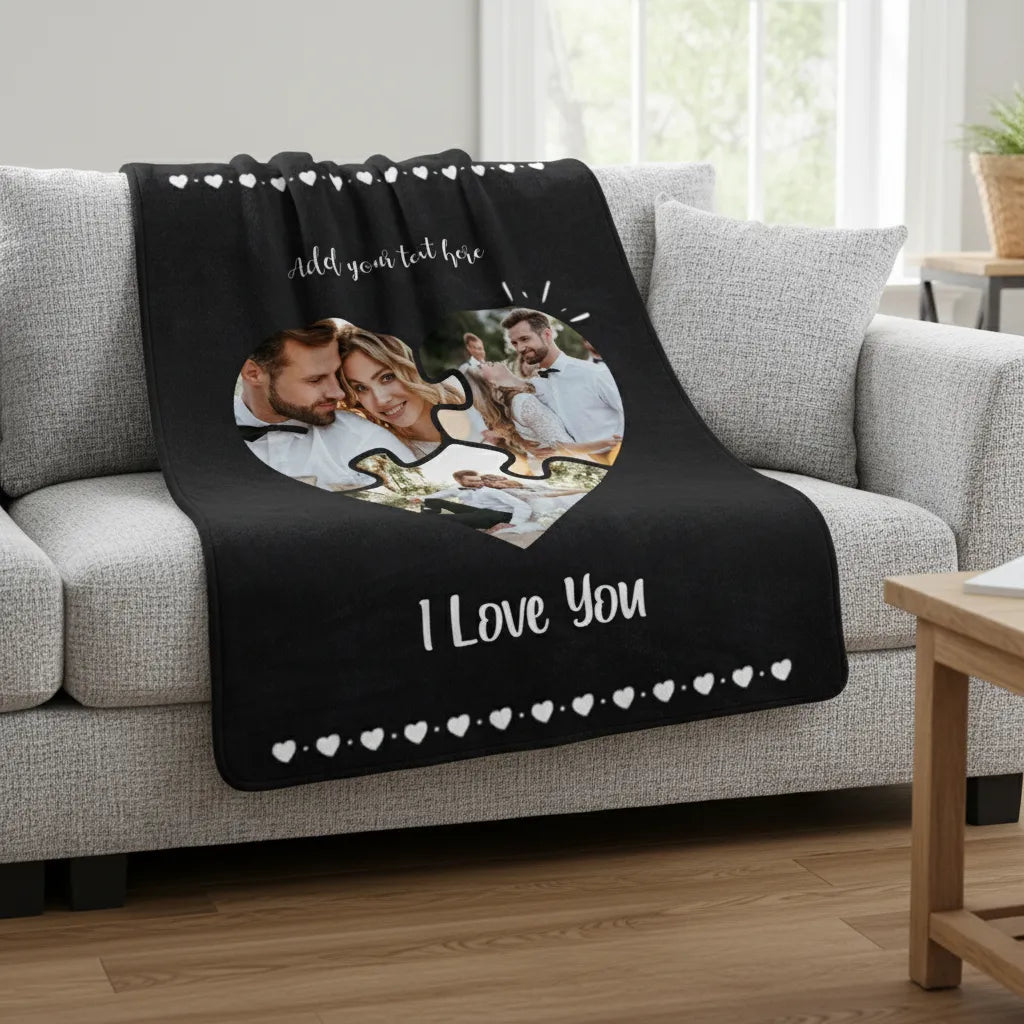 Personalized photo blanket with 'I Love You' text on a sofa in a living room.
