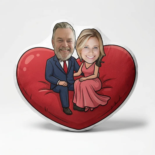 Valentine Pillow with caricature of a man and woman sitting together on a red heart background