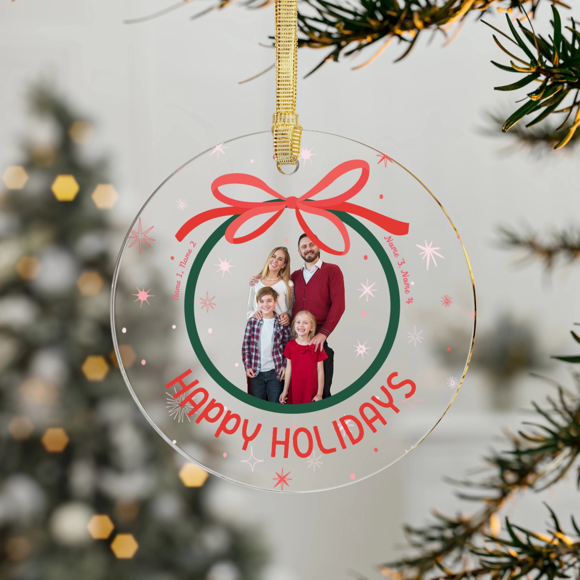 Personalized Christmas ornament with a family photo and 'Happy Holidays' text, hanging on a tree.